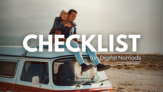 A digital nomad couple sitting on top of a camper van, discussing the checklist to reflect on and assess the suitability of the digital nomad lifestyle.